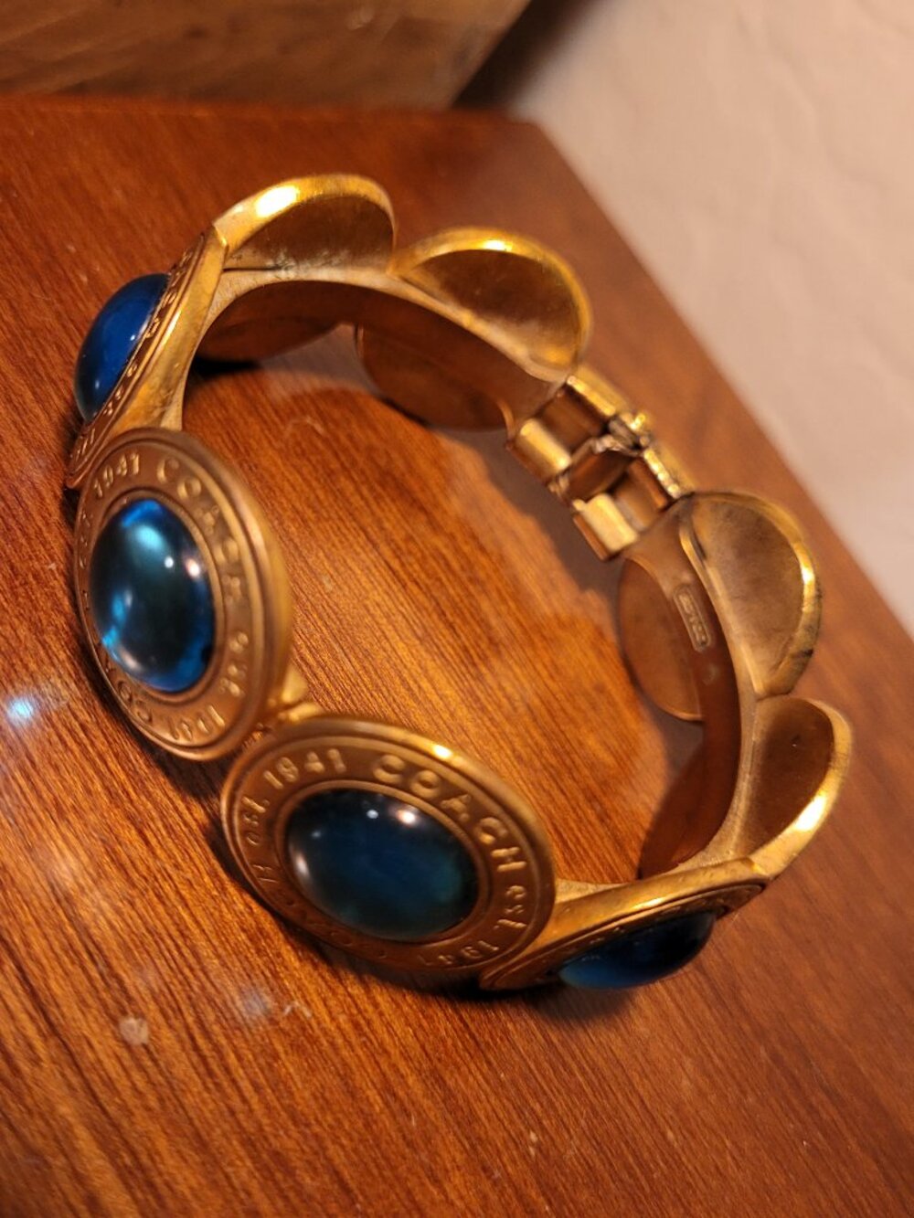 Coach Brass & Gemstone/Glass Cabochon Medallion Hinged Bangle Bracelet Blue